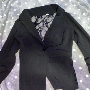 Black blazer, with lace back.